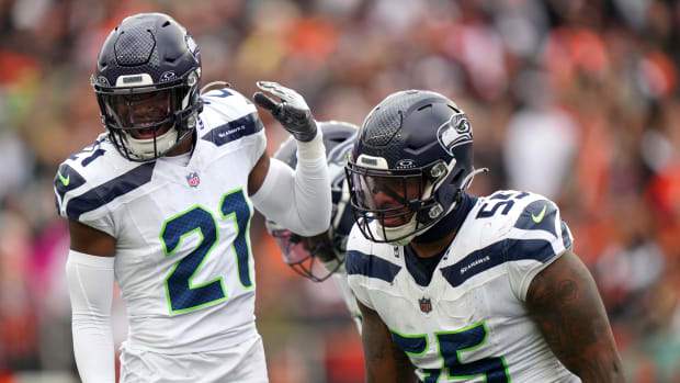 Seattle Seahawks defensive end Dre'Mont Jones (55) is congratulated bySeattle Seahawks cornerback Devon Witherspoon (21) after a sack in the third quarter during an NFL football game between the Seattle Seahawks and the Cincinnati Bengals Sunday, Oct. 15, 2023, at Paycor Stadium in Cincinnati.